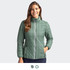 A women's jacket in green with a quilted design and a zip front, featuring a collar and side pockets.