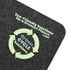 A gray desk mat featuring a circular green recycling symbol and the text "Eco-Friendly Solutions for a Greener Planet."