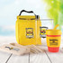 A yellow picnic set including a drink bottle, food container, cutlery, and a colorful cup, all featuring a logo.