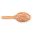 A bamboo hair brush featuring a smooth handle and evenly spaced bristles, designed for hair care.