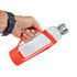 A drink bottle with a clear glass body and a bright red silicone sleeve, held by a hand. It has a metal cap.