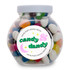 A glass jar filled with assorted colored mini jelly beans, featuring a label that says "candy that's always dandy."