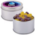 A silver round tin filled with purple and yellow jelly beans, featuring a colorful branded lid.