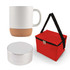An espresso coffee mug with a cork bottom, a compact silver speaker, and a red carrying bag are displayed together.