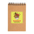 A spiral-bound notebook in brown with a vibrant ramen-themed design on the cover.