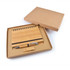 A bamboo notebook with a pen and a matching pen holder, presented in a kraft gift box.