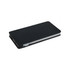 A black wireless power bank with a sleek design, featuring side ports and an integrated charging pad.