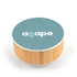 A round speaker and wireless charger with a bamboo base and a teal top featuring a logo.