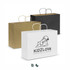 Extra large paper carry bags in brown, black, and white, featuring a logo on the white bag.