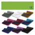 A collection of Yeti Premium Cooling Towels in various colours, neatly rolled and displayed against a green background.