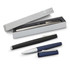 A sleek black and silver Lamy Studio rolling ball pen alongside a blue capped pen, presented in a stylish box.