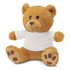 A plush teddy bear in a light brown colour, wearing a plain white t-shirt, with soft features and paw prints.