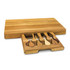 A wooden cheese board with a pull-out drawer containing four cheese knives. The board features a natural wood finish.