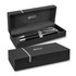 A metal pen set in a sleek black box, featuring a logo and two pens with polished silver accents.