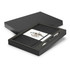 A grey notebook and silver pen gift set presented in a black box with a branded interior.
