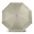 A compact umbrella in a light khaki colour with an octagonal shape and a central opening mechanism. It has a logo.