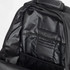 A black backpack interior featuring multiple pockets and compartments for organisation.