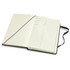 A large hard cover notebook with a black exterior and cream pages, featuring a ribbon bookmark and an inner pocket.