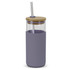 A glass tumbler with a light purple silicone sleeve, a bamboo lid, and a stainless steel straw.