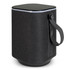 A cylindrical Bluetooth speaker in black with a textured fabric finish and a carrying strap.
