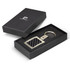 A key ring with a silver metal frame and a carbon fibre design, presented in a black box.