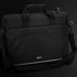 A black laptop bag with dual handles, an adjustable strap, and a logo on the front.