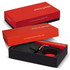 A black leather wallet and a black belt in a two-part red and black gift box with a logo.