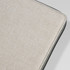 A textured beige cover of a portable drawing set with a black edge. Features a branding logo.