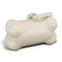 A bone-shaped pet bag dispenser in a natural beige colour, with a simple opening mechanism and a logo.
