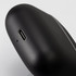 A pair of black TWS earbuds with a charging port, featuring a sleek design and a branding logo.