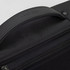 A black anti-theft backpack briefcase with a textured handle and a branding logo on the top.