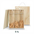 A wooden gift box featuring three compartments filled with shredded paper, with a rope handle for easy carrying.