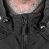 A black soft shell jacket with a zip closure and adjustable hood, featuring a branding logo.