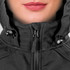 A close-up of a black soft shell jacket featuring a hood and zipper, worn by a model.
