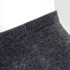 A pair of grey ankle socks, featuring a ribbed cuff and soft texture. The image highlights the sock's upper section.