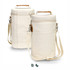 A double wine cooler bag in cream with a front pocket and adjustable shoulder strap, featuring a logo.