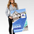 A woman holds a large promotional sign featuring a real estate advertisement with images of a home and pool.