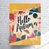 A poster featuring autumn-themed illustrations with colourful leaves and flowers, displaying the text "Hello Autumn."