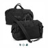 A black duffle bag with two handles and a detachable shoulder strap, featuring a logo and a sleek design.