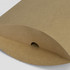 A tan extra large pillow box with a curved flap and a small opening at the top. It features a subtle texture.