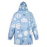 A blue blanket hoodie featuring cloud and hot air balloon patterns, with a hood and long sleeves. It has a logo.