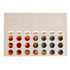 A rectangular game board in light beige with circular holes, featuring red and blue game pieces positioned inside.