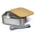 A stainless steel lunch box with a bamboo lid and a grey elastic strap, featuring a sleek design.