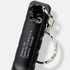 A black rechargeable torch keyring featuring a metal attachment for convenience and a USB charging port.