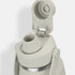 A drink bottle in light grey with a screw-on lid and spout, featuring a logo on the body.