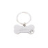 A metallic dog bone keytag with a keyring, featuring a logo and a paw print design.