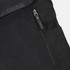 A black canvas backpack featuring a zippered compartment and a side pocket, with a logo on its surface.