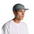 A five-panel cap in light blue worn by a person facing sideways, showcasing its design and fit.