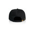 A black five-panel cap featuring a rear adjustment strap and branding on the back.