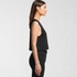 A black crop tank top with a relaxed fit, featuring a sleeveless design. The model is shown in profile.